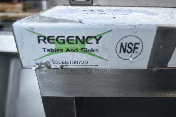 BRAND NEW SCRATCH AND DENT! Regency 600EBT3072D 30" x 72" 16 Gauge Type 304 Stainless Steel Enclosed Base Table with Sliding Doors and Adjustable Midshelf - Image 3 of 3
