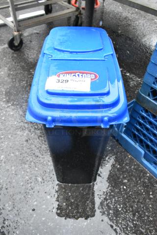 Black Poly Trash Can w/ Blue Lid.