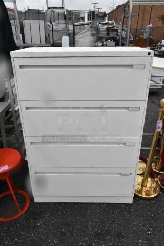 White Metal 4 Drawer Filing Cabinet.