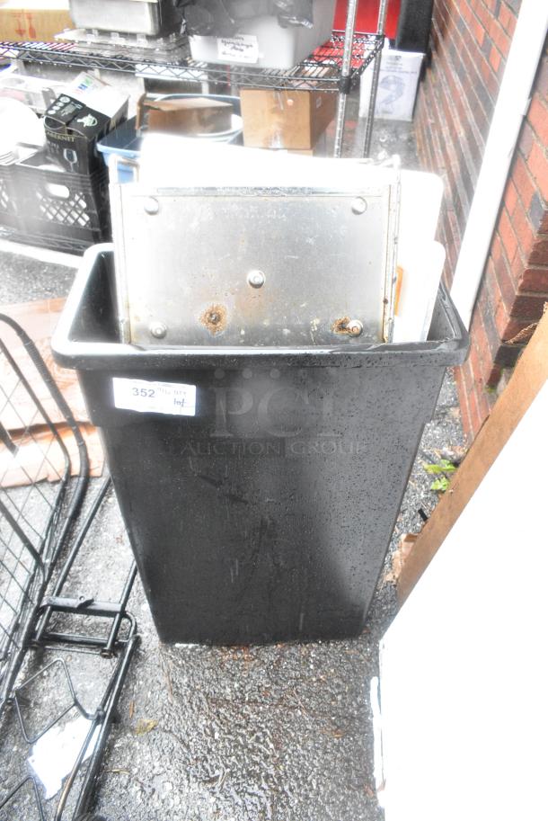 ALL ONE MONEY! Lot of Black Poly Slim Jim Trash Can w/ Contents Including Metal Pieces and Poly Lids - Image 1 of 4