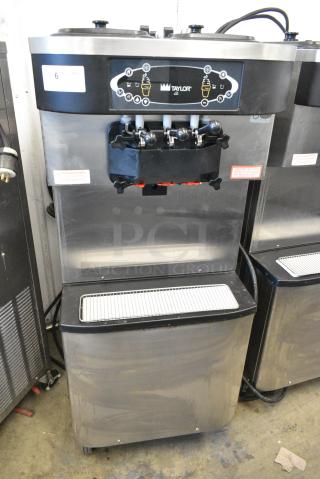 Taylor C713-33 Stainless Steel Commercial Floor Style Water Cooled 2 Flavor w/ Twist Soft Serve Ice Cream Machine on Commercial Casters. 208-230 Volts, 3 Phase. - Item #1156325