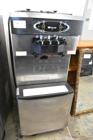 Taylor C713-33 Stainless Steel Commercial Floor Style Water Cooled 2 Flavor w/ Twist Soft Serve Ice Cream Machine on Commercial Casters. 208-230 Volts, 3 Phase. - Item #1156329