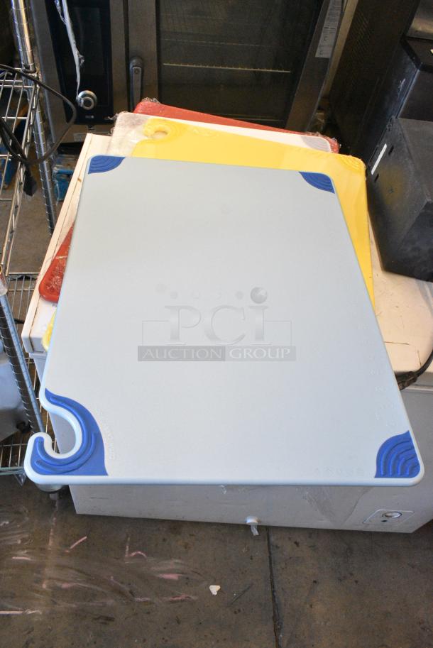 8 BRAND NEW SCRATCH AND DENT! Cutting Boards Including San Jamar CBG182412BL Saf-T-Grip® 24" x 18" x 1/2" Blue Cutting Board with Hook, San Jamar CBG182412YL Saf-T-Grip® 24" x 18" x 1/2" Yellow Cutting Board with Hook, San Jamar CBG182412WH Saf-T-Grip® 24" x 18" x 1/2" White Cutting Board with Hook, San Jamar CBG182412RD Saf-T-Grip® 24" x 18" x 1/2" Red Cutting Board with Hook. 8 Times Your Bid! - Image 1 of 10
