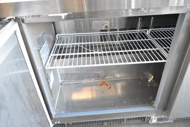 BRAND NEW SCRATCH AND DENT! 2024 Avantco 178ZUC60FHC Stainless Steel 60" Front Breathing Undercounter Freezer on Commercial Casters. 115 Volts, 1 Phase. Tested and Working! - Image 4 of 6