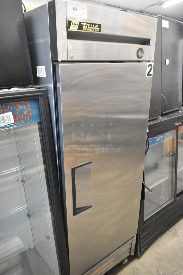 True T-19F Stainless Steel Commercial Single Door Reach In Freezer w/ Poly Coated Racks on Commercial Casters. 1 Caster Needs To Be Reattached. 115 Volts, 1 Phase. Tested and Working! - Image 1 of 5