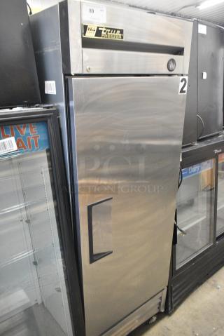 True T-19F Stainless Steel Commercial Single Door Reach In Freezer w/ Poly Coated Racks on Commercial Casters. 1 Caster Needs To Be Reattached. 115 Volts, 1 Phase. - Item #1156428