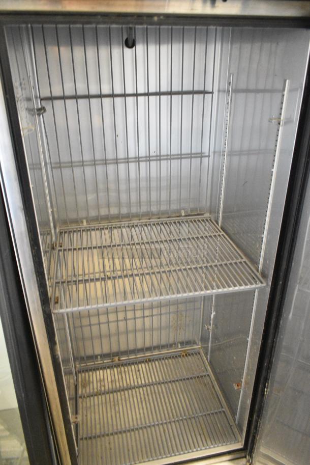 True T-19F Stainless Steel Commercial Single Door Reach In Freezer w/ Poly Coated Racks on Commercial Casters. 1 Caster Needs To Be Reattached. 115 Volts, 1 Phase. Tested and Working! - Image 4 of 5