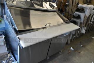 BRAND NEW SCRATCH AND DENT! 2024 Avantco 178SSPT48MHC 48" 2 Door Mega Top Stainless Steel Refrigerated Sandwich Prep Table on Commercial Casters. 115 Volts, 1 Phase. Tested and Working!
