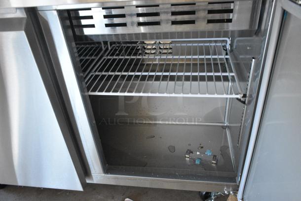 BRAND NEW SCRATCH AND DENT! 2024 Avantco 178SSPT48MHC 48" 2 Door Mega Top Stainless Steel Refrigerated Sandwich Prep Table on Commercial Casters. 115 Volts, 1 Phase. Tested and Working! - Image 6 of 7