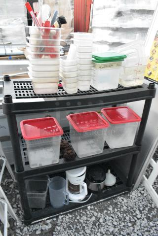 Black Poly 3 Tier Shelving Unit w/ Contents Including Poly Bins and Lids.