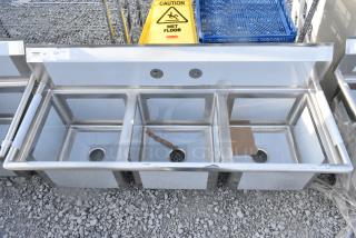 BRAND NEW SCRATCH AND DENT! Regency 600S31717 60" 16 Gauge Stainless Steel Three-Compartment Commercial Sink - 17" x 17" x 12" Bowls. No Legs.