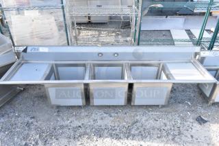BRAND NEW SCRATCH AND DENT! Regency 600S31818218 94" 16 Gauge Stainless Steel Three Compartment Commercial Sink with Cross Bracing and 2 Drainboards - 18" x 18" x 14" Bowls. No Legs.