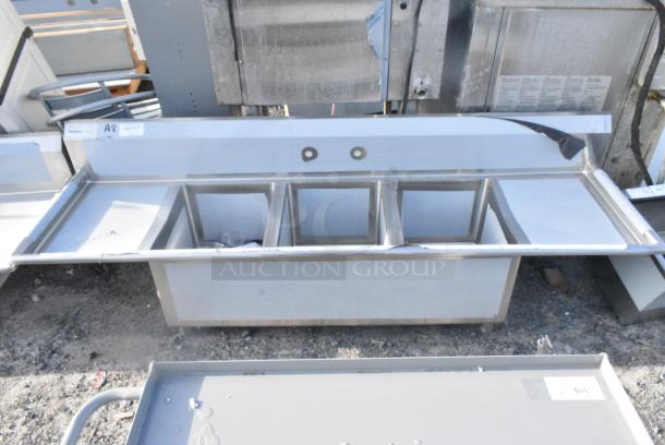BRAND NEW SCRATCH AND DENT! Regency Spec Line Stainless Steel Three Compartment Commercial Sink with Galvanized Steel Legs and 2 Drainboards. No Legs. - Image 1 of 6
