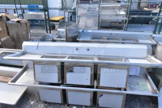 BRAND NEW SCRATCH AND DENT! Regency 600S3181818X 94" 16 Gauge Stainless Steel Three Compartment Commercial Sink with Cross Bracing and 2 Drainboards - 18" x 18" x 14" Bowls. No Legs.