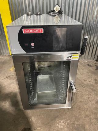Sweet! Blodgett Commercial Stainless Steel Electric Powered Boilerless Mini Size Combi Oven! With Built In Pan Holding Rack! With Android-Based Touch Screen Controls! With Hand Shower Attachment! Model: BLCT-10E SN: 011918BT115S! 208V 3 Phase! On Legs! Working When Removed!