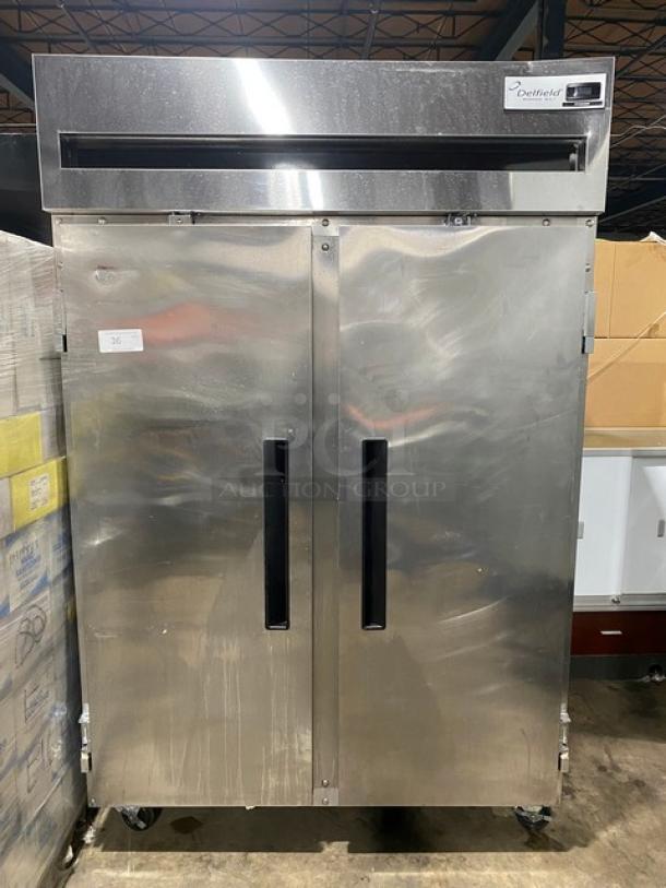 Delfield 6000XL Series Commercial Stainless Steel Solid 2 Door Reach In Freezer! With Wire Racks! 115V 1 Phase! On Casters! - Image 1 of 10