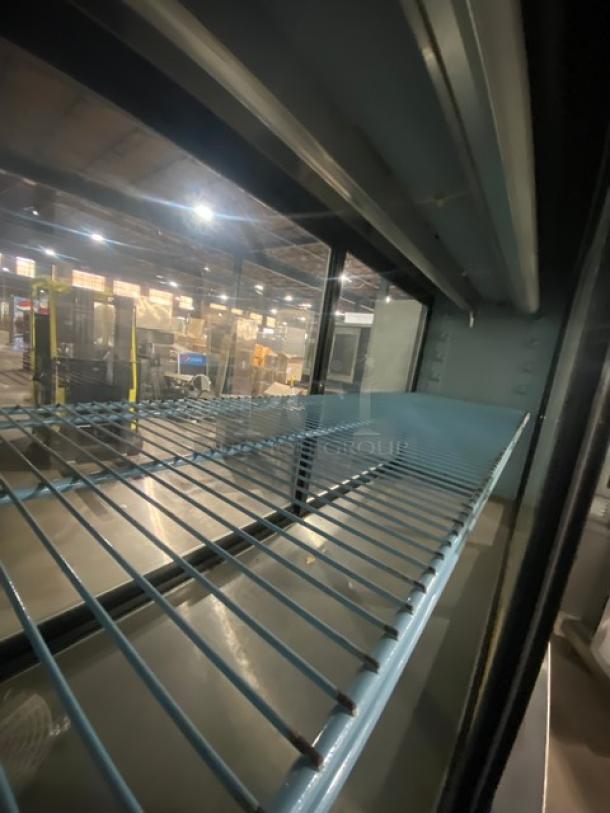 Delfield Commercial Stainless Steel Refrigerated Pass-Through Merchandiser Display Showcase! With 2 Tier Storage Base Underneath! With Adjustable Poly Coated Wire Rack! Model: 5PC72N SN: 0402036000912M! 120V 1 Phase! On Legs! - Image 5 of 9