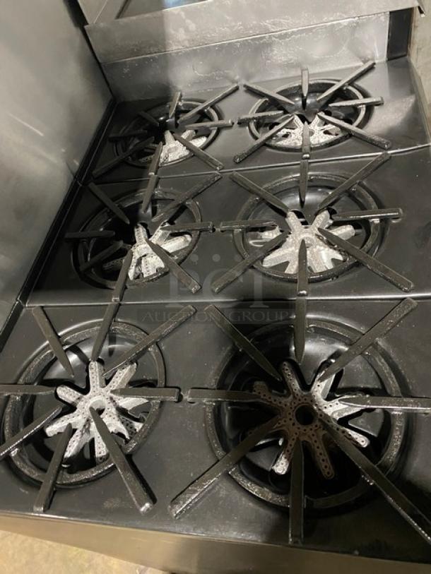 Wow! Garland Commercial Stainless Steel Natural Gas Powered 6 Burner Range/Flat Griddle Split Top & Double Oven Combo! With Back Splash & Overhead Salamander Shelf! With Wired Oven Racks! On Casters! Working When Removed! - Image 6 of 12