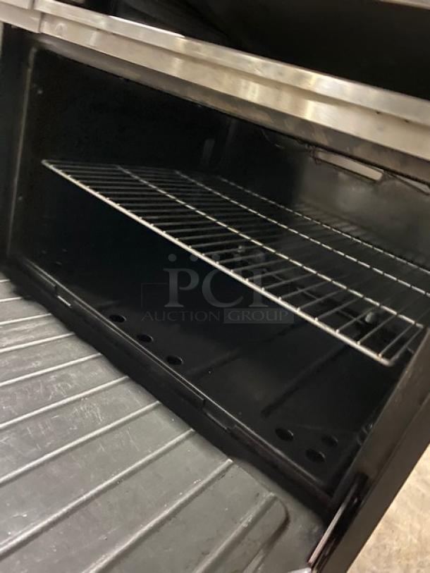 Wow! Garland Commercial Stainless Steel Natural Gas Powered 6 Burner Range/Flat Griddle Split Top & Double Oven Combo! With Back Splash & Overhead Salamander Shelf! With Wired Oven Racks! On Casters! Working When Removed! - Image 10 of 12