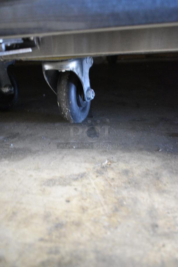 BRAND NEW! 2022 Migali C-3R-HC Stainless Steel Commercial 3 Door Reach In Cooler w/ Poly Coated Racks on Commercial Casters. 115 Volts, 1 Phase. Serial C-3R-HC003220309092C0028. Tested and Working! - Image 4 of 8