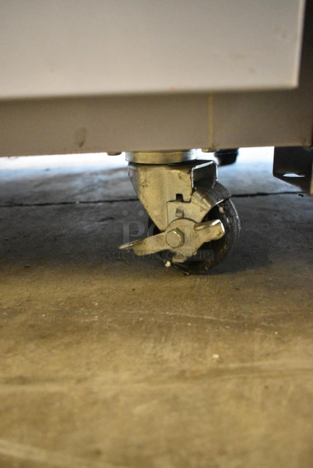 BRAND NEW! 2023 Migali EVOx-2F Stainless Steel Commercial 2 Door Reach In Freezer w/ Poly Coated Racks on Commercial Casters. 208/230 Volts, 1 Phase. Serial 10156832 - Image 3 of 6