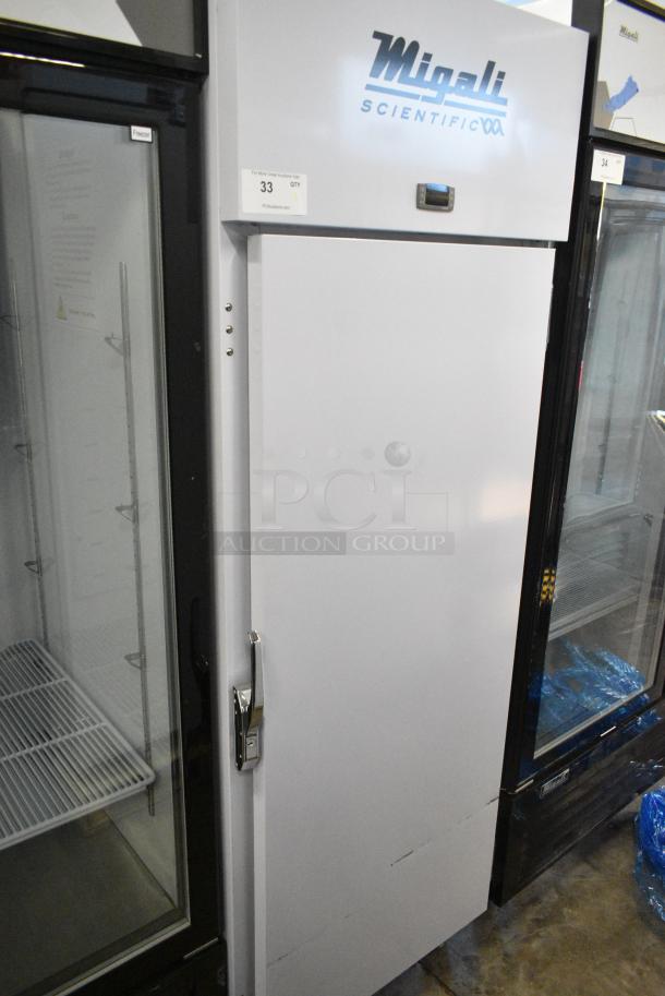 BRAND NEW! Migali EVOx-1F Metal Commercial Single Door Reach In Freezer w/ Poly Coated Racks on Commercial Casters. 115 Volts, 1 Phase. Serial 10156833. Tested and Powers On But Does Not Get Cold - Image 1 of 5
