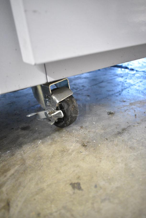 BRAND NEW! Migali EVOx-1F Metal Commercial Single Door Reach In Freezer w/ Poly Coated Racks on Commercial Casters. 115 Volts, 1 Phase. Serial 10156833. Tested and Powers On But Does Not Get Cold - Image 3 of 5