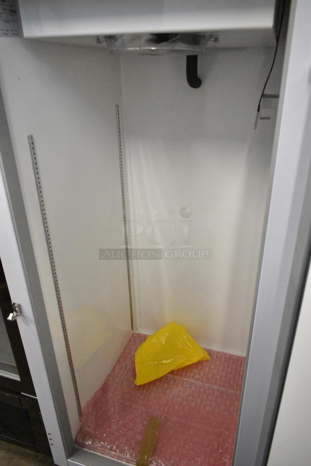 BRAND NEW! Migali EVOx-1F Metal Commercial Single Door Reach In Freezer w/ Poly Coated Racks on Commercial Casters. 115 Volts, 1 Phase. Serial 10156833. Tested and Powers On But Does Not Get Cold - Image 4 of 5