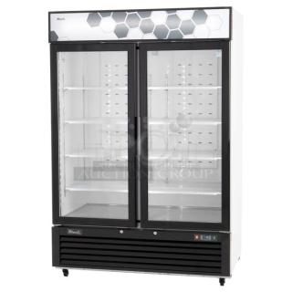 BRAND NEW! 2022 Migali C-49FM-HCe Metal Commercial 2 Door Reach In Freezer Merchandiser w/ Poly Coated Racks on Commercial Casters. 115 Volts, 1 Phase. Serial C-49FM-HCe003221216092C0011. Tested and Working!