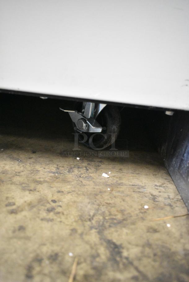 BRAND NEW SCRATCH AND DENT! 2023 Avantco 178MC49HC Stainless Steel Commercial Milk Cooler on Commercial Casters. 115 Volts, 1 Phase. Tested and Working! - Image 3 of 7