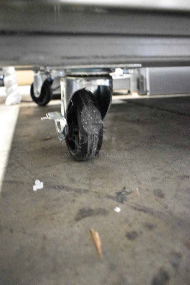 BRAND NEW SCRATCH AND DENT! 2024 Avantco 178SS3RHC Stainless Steel Commercial 3 Door Reach In Cooler w/ Poly Coated Racks on Commercial Casters. 115 Volts, 1 Phase. Tested and Working! - Image 3 of 7