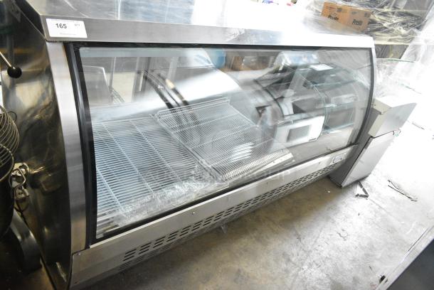 BRAND NEW SCRATCH AND DENT! 2023 Avantco 178DLC82HCS 82" Stainless Steel Curved Glass Refrigerated Deli Case Merchandiser. 115 Volts, 1 Phase. Tested and Working! - Image 1 of 5