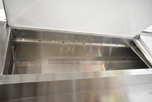 BRAND NEW SCRATCH AND DENT! 2024 Avantco 178SSPPT3 Stainless Steel Commercial 3 Door Refrigerated Pizza Prep Table on Commercial Casters. 115 Volts, 1 Phase. Tested and Working! - Image 5 of 13