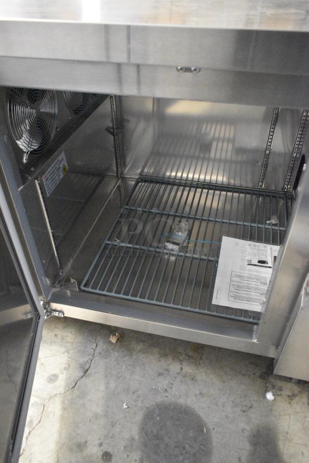 BRAND NEW SCRATCH AND DENT! 2024 Avantco 178SSPPT3 Stainless Steel Commercial 3 Door Refrigerated Pizza Prep Table on Commercial Casters. 115 Volts, 1 Phase. Tested and Working! - Image 7 of 13