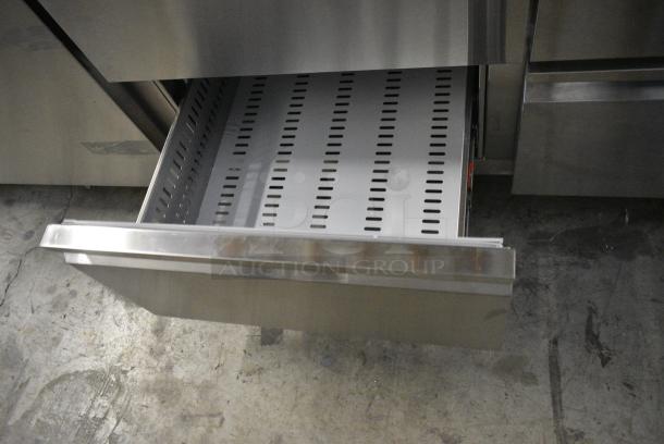 BRAND NEW SCRATCH AND DENT! 2024 Avantco 178SSPPT3 Stainless Steel Commercial 3 Door Refrigerated Pizza Prep Table on Commercial Casters. 115 Volts, 1 Phase. Tested and Working! - Image 9 of 13