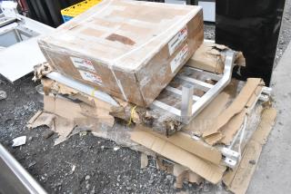 5 BRAND NEW SCRATCH AND DENT! Items Including Metro RPC5-HM2000 Module 120v 2000w, Choice FNGRMT3 3' x 5' Black Rubber Finger-Scraper Top Anti-Fatigue Mat - 1/2" Thick, Regency 600DUN2048 20" x 48" Mobile Aluminum Dunnage Rack - 1600 lb. Capacity, Regency 109APR1820L 20 Pan End Load Bun / Sheet Pan Rack with Non-Marking Casters - Unassembled. 5 Times Your Bid!