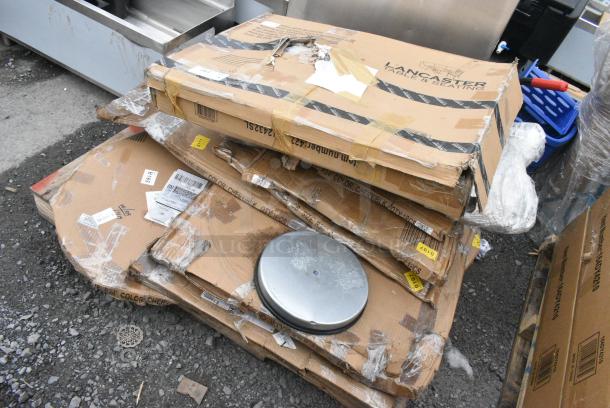 9 BRAND NEW SCRATCH AND DENT! Items Including 427CAU2432SL Lancaster Table & Seating 24" x 32" Silver Powder-Coated Aluminum Dining Height Outdoor Table with Umbrella Hole, 164RS36SS Lancaster Table & Seating Stainless Steel Silver 36" Crowd Control / Guidance Stanchion with 78" Retractable Belt, 600LEGSS711 Regency 28" Stainless Steel Leg for Work Tables - 5" Casters Required, 2 34924RTCB Lancaster Table & Seating 24" Laminated Round Table Top Reversible Cherry / Black. 9 Times Your Bid! - Image 2 of 8