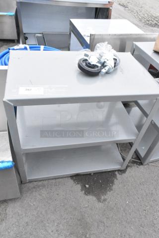 BRAND NEW SCRATCH AND DENT! Lavex Gray Metal 3 Tier Cart w/ 2 Commercial Casters.