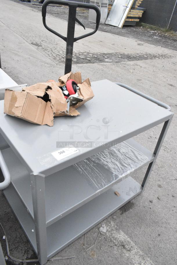 BRAND NEW SCRATCH AND DENT! Lavex Gray Metal 3 Tier Cart w/ Commercial Casters. - Image 1 of 4