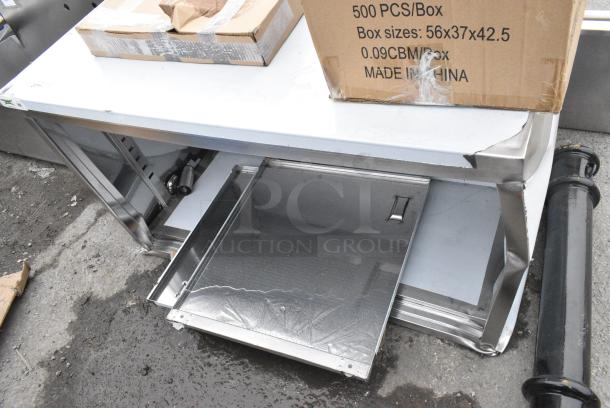 BRAND NEW SCRATCH AND DENT! Regency 600EBT3048D 30" x 48" 16 Gauge Type 304 Stainless Steel Enclosed Base Table with Sliding Doors and Adjustable Midshelf - Image 3 of 4