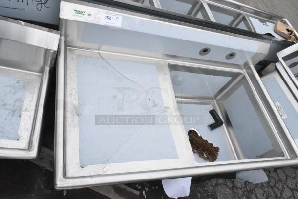 BRAND NEW SCRATCH AND DENT! Regency 600S1242424L 50 1/2" 16 Gauge Stainless Steel One Compartment Commercial Sink with Galvanized Steel Legs and 1 Drainboard - 24" x 24" x 14" Bowl. No Legs. - Image 1 of 4