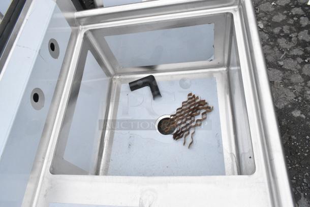 BRAND NEW SCRATCH AND DENT! Regency 600S1242424L 50 1/2" 16 Gauge Stainless Steel One Compartment Commercial Sink with Galvanized Steel Legs and 1 Drainboard - 24" x 24" x 14" Bowl. No Legs. - Image 3 of 4
