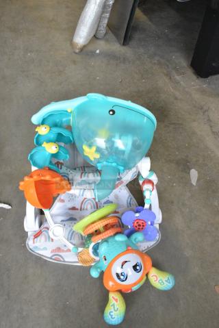 3 Various Items Including ABC Toy, Whale Toy and Baby Chair. 3 Times Your Bid!