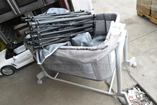 3 Various Items Including Kids 2 Bassinet on Casters. Carrier and Frame. 3 Times Your Bid!
