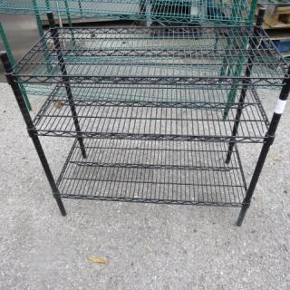 One Black Metro Shelf With 3 Shelves. 24X14X33