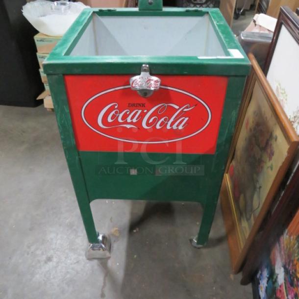 One Vintage Look Coca Cola Merchandiser With Drain On Casters. Missing 1 Caster. 17.5X7.5X30 - Image 1 of 1