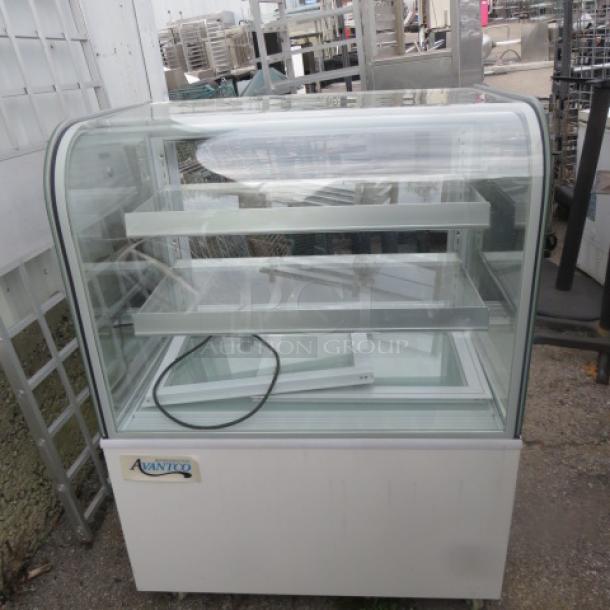 One Avantco Curved Glass Dry Bakery Display Case. Model# 193BCD36W. 110-120 Volt. $1499.00. - Image 1 of 2