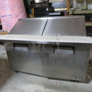 One WORKING  True 2 Door Refrigerated Prep Table With Cutting Board, And 2 Racks On Casters. Model# TSSU60. 115 Volt. 60X34X46. $4803.17