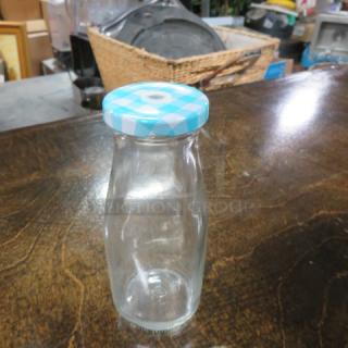 One Lot Of 4 -11oz Milk Bottles With Lids.