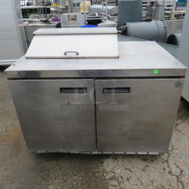 One Delfield 2 Door Refrigerated Prep Table On Casters. Model# 4448N-8. 115 Volt. 48X32X43. $4468.00 - Image 1 of 2